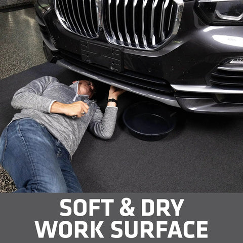 Man working under car on XL Oil Spill Mat For Garage Floors Premium Absorbent Oil Pad Reusable And Washable Durable