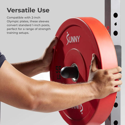 Person installing 2-Inch Olympic Weight Plate Sleeve Adapter For Power Racks And Home Gyms Converts 1-Inch Standard Posts To 2-Inch
