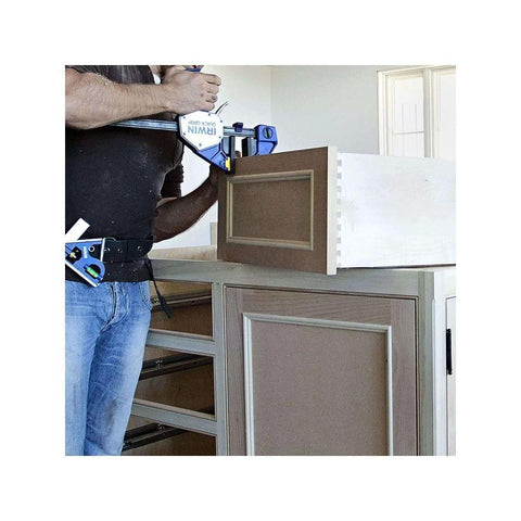 IRWIN Quick-Grip bar clamp for woodworking, one-handed micro 4-1/4", blue clamp securing cabinet door