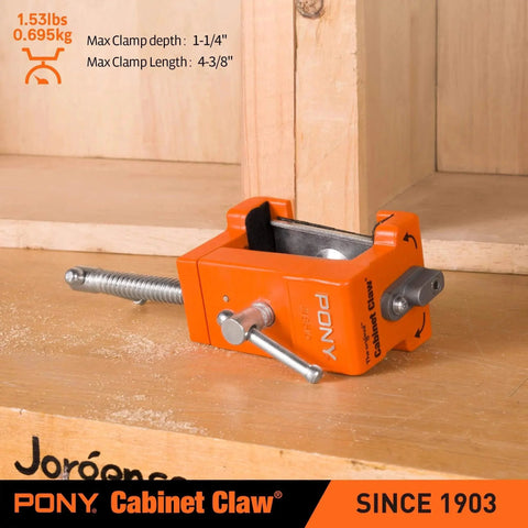 Close-up of 2 Pack Pony 8510 Cabinet Claw Face Frame Clamp in orange on wooden surface.