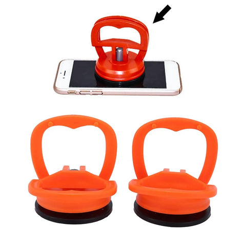 Two Pack Suction Cup Lifter for Glass and Tile with orange grips, shown lifting a smartphone