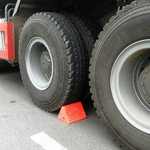 Heavy Duty Orange Wheel Chocks 2 Pack With Eyebolt For Travel Trailer securing truck tires on asphalt