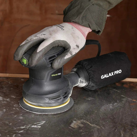 280W Orbital Sander 13000 RPM With Dust Collection And 15 Discs in use on a metal surface, attached dust bag visible