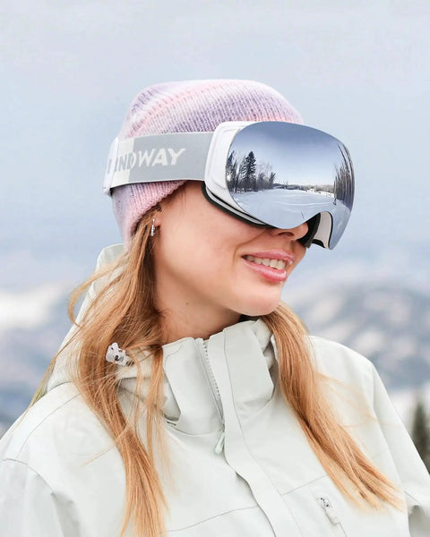 Woman wearing Ski Goggles OTG For Men And Women Interchangeable Magnetic Lenses UV Protection in snowy mountain setting
