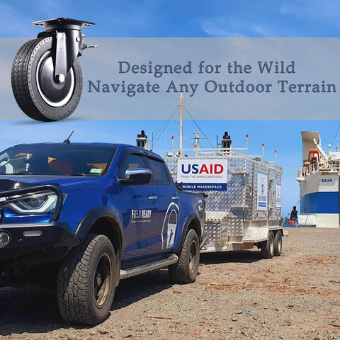 Truck towing a trailer equipped with casters, highlighting the durability of the wheels in rugged outdoor terrain.