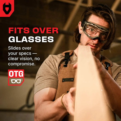 Craftsman wearing Over Glasses Safety Goggles Anti Fog ANSI Z87.1 Panoramic Lens Adjustable Strap while measuring wood