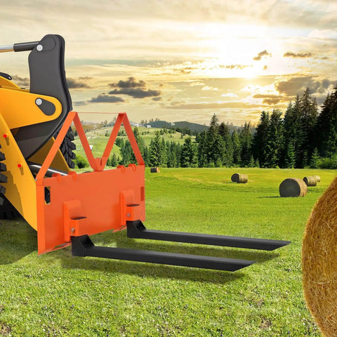 Heavy Duty 46 Inch Pallet Fork Attachment For Tractor Loader And Skid Steer Universal Quick Attach With 2600 Lb Per Fork Load Capacity For Farm Warehouse And Material Handling in a field.