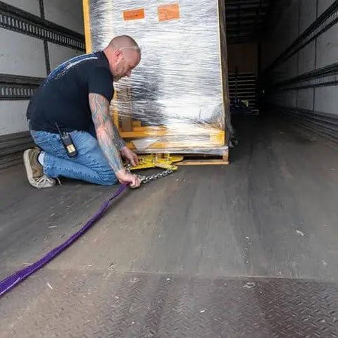 Man using Heavy Duty Double Scissor Pallet Puller For Easy Pallet Moving, 4 Inch Jaw Opening, 5000 Lb Capacity on truck floor