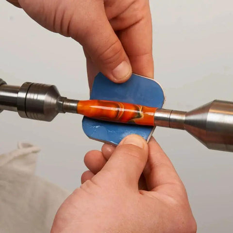 Applying Pen Sanding Kit with Soft Touch Pads 1500 to 12000 grit on colorful pen blank for smooth finishing