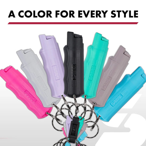 Compact police-strength pepper spray with quick release keychain, multiple colors, secure finger grip, 12-14 ft spray reach.