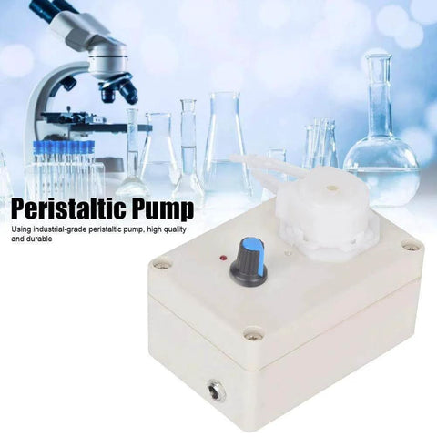 Peristaltic Pump with adjustable control knob for laboratory use, microscope and glassware in background