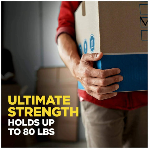 Person holding heavy box sealed with Scotch Heavy Duty Shipping Packing Tape With Dispenser, Clear 1.88 In X 27.7 Yd, 1 Roll