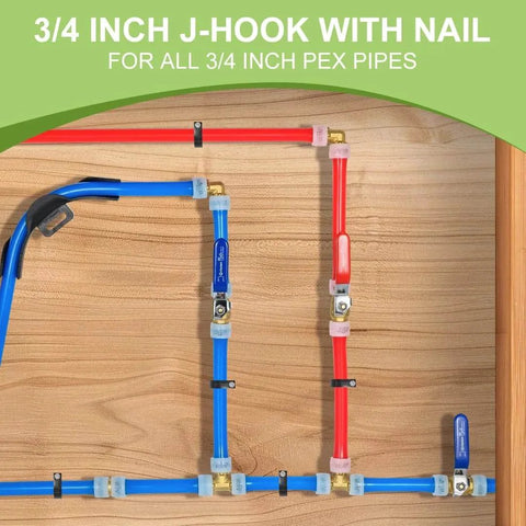 Plumbing installation with red and blue 3/4 inch PEX pipes using J-hooks and nails on wooden board.