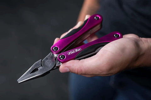 Close-up of a Pink 14-In-1 Aluminum Multi-Tool with stainless steel pliers, compact for DIY, home, camping, and everyday carry.