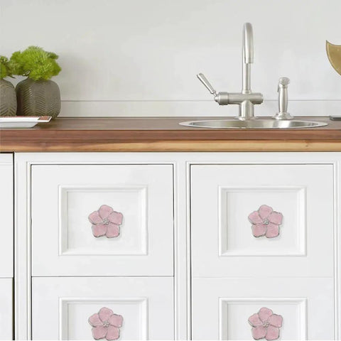 Petal Flower Drawer Pulls set on kitchen cabinet drawers with pink rhinestone inlays, zinc alloy single hole handles in silver finish