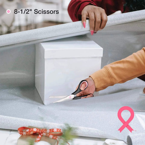Close-up of a person using scissors from Pink 263-Piece Home Repair Tool Kit With Wide Mouth Storage Bag For DIY Projects And Breast Cancer Awareness Ribbon