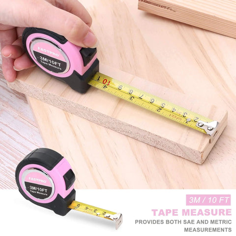 Pink tape measure from Pink 7-Piece Tool Kit For Women Home Repair Set showing 3m/10ft length on wooden board