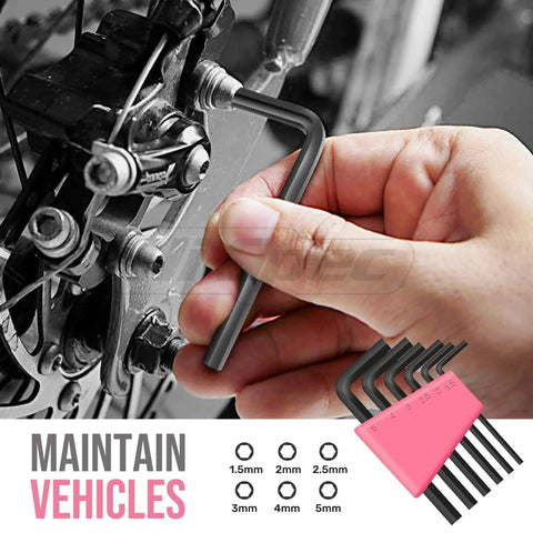 Using an Allen wrench from the Pink 25 Piece Women DIY Tool Kit Set in Compact Mini Toolbox for Beginners Home Repairs on a bike