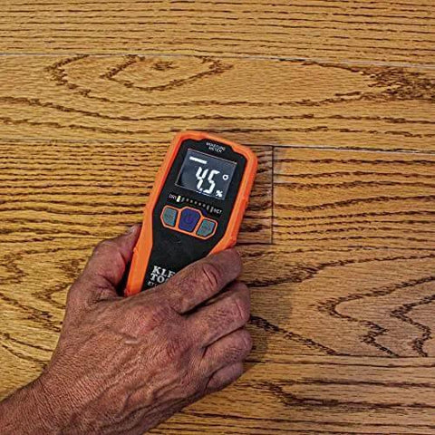 Pinless Moisture Meter for Non-Destructive Moisture Detection in Drywall, Wood, and Masonry; Detects up to 3/4-Inch Below Surface in use on wooden floor.
