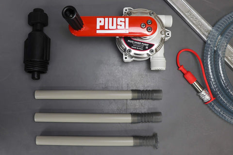 ArmorBlue Piusi Rotary Drum Pump for Diesel Exhaust Fluid (DEF) | 10 Gallons per 100 rotations | No Power Required | Integrated Check Valve | DEF Pump | F00332A3A components shown on a table, including pump, tubes, and accessories.