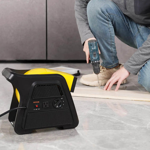 Pivoting Utility Fan 600 CFM High Velocity Floor Blower for Drying Cooling Ventilation and Exhaust used during flooring installation.