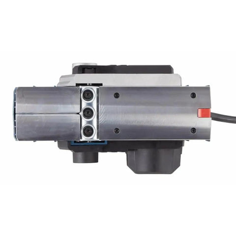 Efficient Three And A Quarter Inch Planer Kit Delivers Precise Stock Removal With A Powerful Six Point Five Amp Motor And Sixteen Thousand Five Hundred RPM Featuring A Dual Mount Guide Fence And Woodrazor Blades To Create Smooth Straight Edges On Doors, close-up of planer blades and motor.
