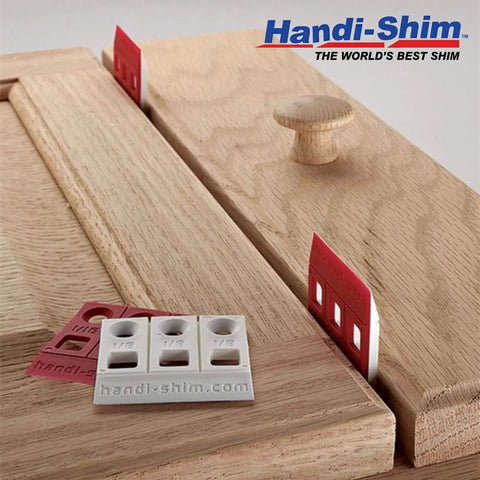 Heavy Duty Reusable Plastic Construction Shims Set Of 100 For Spacing Leveling And Plumbing Projects in use on a cabinet