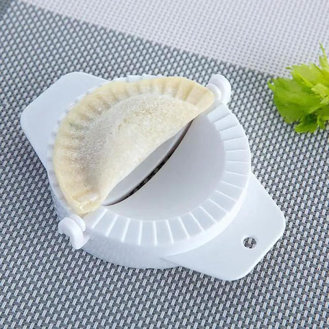 No Fuss Dumpling Maker Press Kit 3Pcs Small Nonstick Plastic Dumpling Mold with dough on grid background