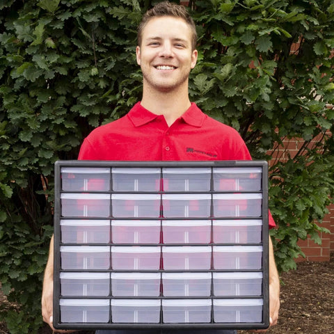 Man holding a 24-Drawer Plastic Storage Cabinet For Garage Organization And Craft Storage, Small Parts Organizer, Black