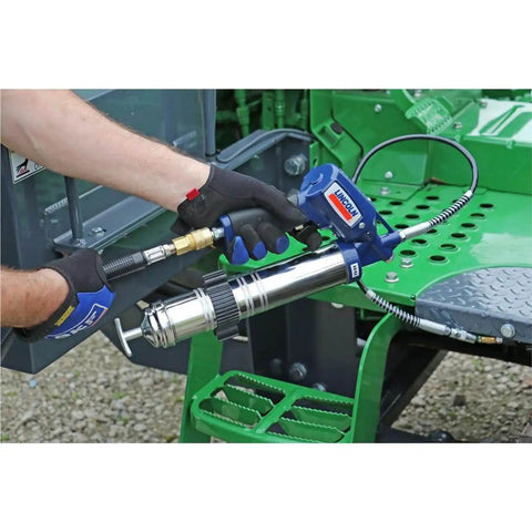 Heavy Duty Pneumatic Grease Gun With 30 Inch High Pressure Hose And 6000 PSI Power in use on industrial machinery