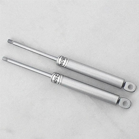 Vertical Swing Lift Up Stay Pneumatic for Cabinet Door hardware, silver finish; two durable pneumatic arms on display.