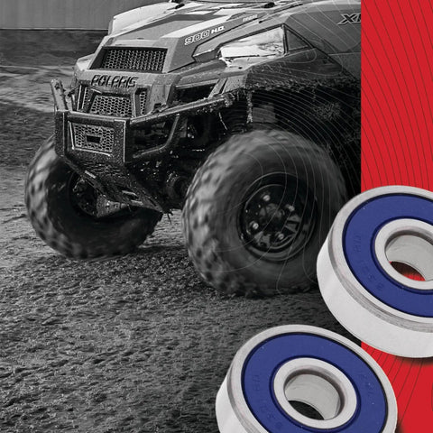 Front Wheel Bearing Kit For Honda Motorcycles 25-1072 Replacement, close-up of bearings with off-road vehicle in background