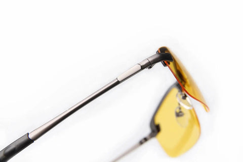 Close-up of Polarized Night Driving Glasses Anti Glare For Enhanced Night Vision showing yellow lens and metal frame