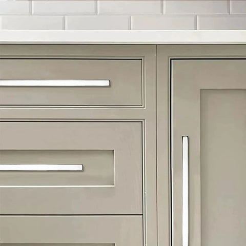 Front view of 10 Pack Five Inch Center To Center Polished Nickel Square Cabinet Pulls on wooden kitchen cabinets and drawers.
