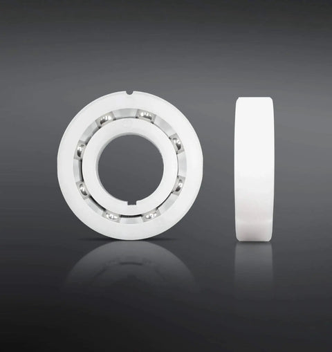 Bearing Replacement Kit For Hayward Navigator Automatic Pool Cleaner By Swimables, front and side view of white bearing with stainless steel balls