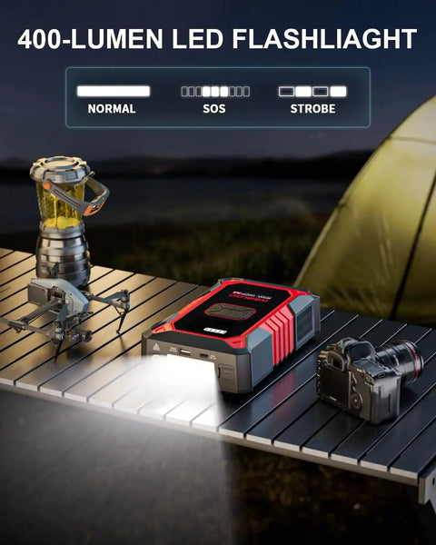 Portable 3000A Jump Starter With Air Compressor for cars and trucks on table with LED flashlight feature at campsite