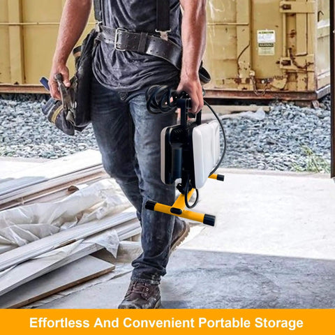 Man carrying All In One LED Work Light With Stand For Night Jobs And Camping, 11000 Lumen Foldable Outdoor Light, 2 Meter Cord