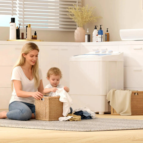 Compact 16 lb portable washer dryer combo in a small apartment laundry area with a woman and child folding clothes.