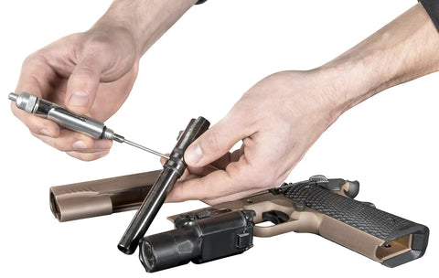 Person using Precision Oiling Pen For Tight Spots And Machinery Titan 15200 Precision Oiler on a disassembled gun component.