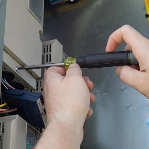 All-In-One 27-In-1 Precision Screwdriver Set For Apple Device Repairs With Rare-Earth Magnet Barrel, being used on electronics