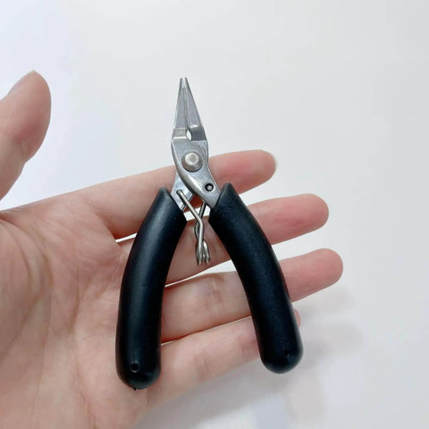 All In One Candle Making Kit For DIY Fans With Punching Needle Wick Insertion Tools Large Eye Hook Mold Wicks And Other Candle Making Essentials In A Durable Portable Case By Phinicco - Close-up of needle nose pliers with black handles.