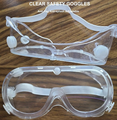 Protective Safety Goggles Anti Splash Wide Vision Fits Over Prescription Glasses with clear lenses on wood surface.