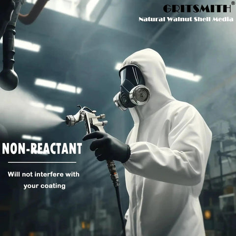Person in white protective suit using spray tool, emphasizing 'non-reactant' feature suitable for use with coatings.