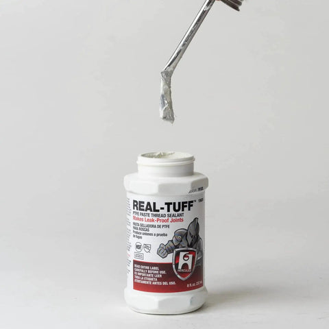 Real-Tuff Heavy Duty PTFE Pipe Thread Sealant in white for all metals PVC CPVC and ABS plastics, 8 oz bottle with applicator