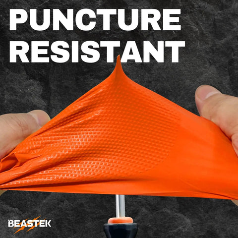 Hands stretching 8 Mil Nitrile Powder Free Gloves Diamond Textured Heavy Duty Orange 100Pcs showcasing puncture resistance.