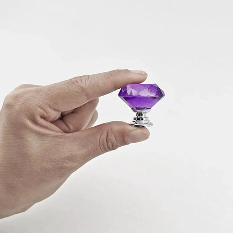 Person holding Purple Diamond Crystal Cabinet Knob 1.2 Inch with Chrome Alloy Base, part of 6 Pack Glass Drawer Pulls for Cabinets.