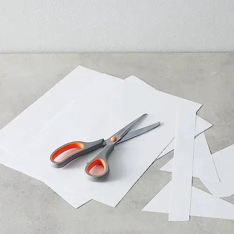 Stainless Steel Scissors Multipurpose Office And Craft Shears With PVD Coated Blades For Superior Cutting Power on paper background