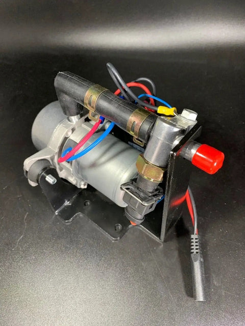 Ultra Quiet Rotary Vane Vacuum Pump For Brake Boosters Delivers Up To 28 Inches Of Vacuum In Seconds side view on black surface