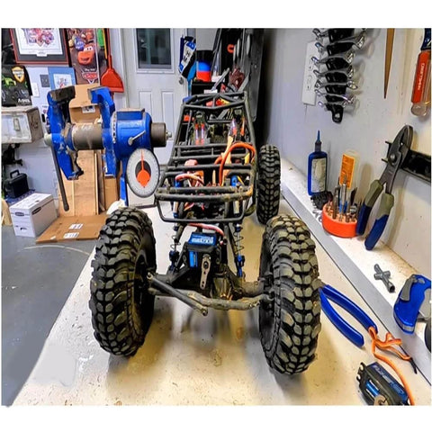 RC car with visible components in workshop, potential use for 35kg high Torque Coreless Motor servo Metal Gear Digital.