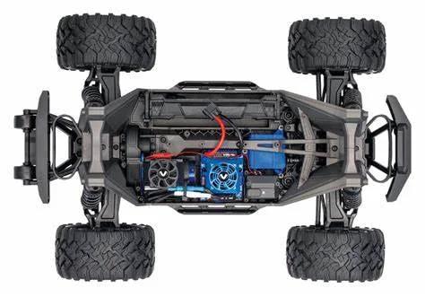 Top view of RC truck chassis showcasing 1000pcs Universal RC Screw Kit Hardware Assortment with M3 and M4 screws, washers, nuts.